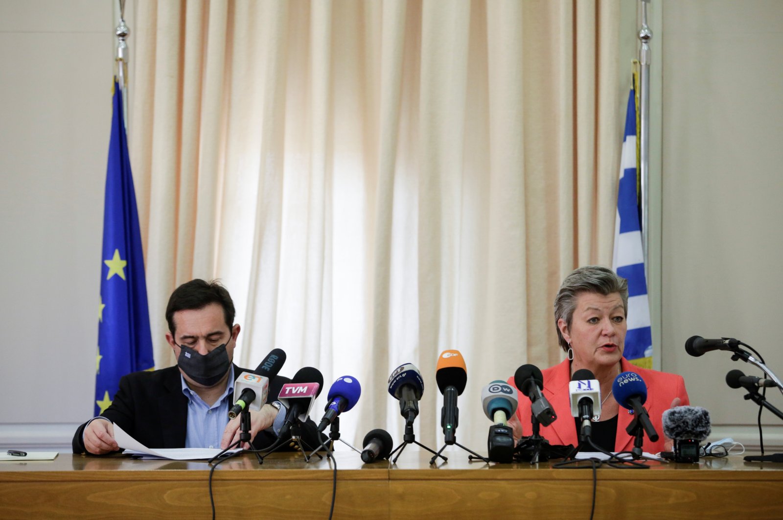 Greek Migration Minister Notis Mitarachi (L) listens as European Commissioner for Home Affairs, Ylva Johansson speaks during a joint news conference, in the city of Mytilene, on the island of Lesbos, Greece, March 29, 2021. (Reuters Photo)