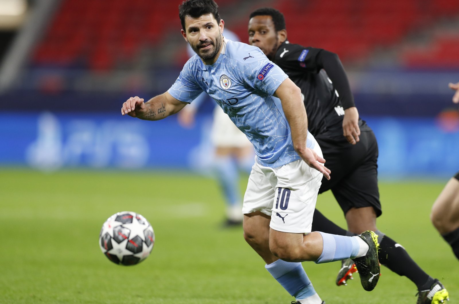Manchester City's Sergio Aguero chases the ball during a Champions League round of 16 second-leg match against Borussia Moenchengladbach at the Puskas Arena, Budapest, Hungary, March 16, 2021. (AP Photo)