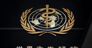 The logo of the World Health Organization (WHO) written in Chinese stands at the entrance of their headquarters in Geneva, Switzerland, Feb. 24, 2020. (AFP Photo)