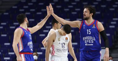 Anadolu Efes' Vasilije Micic (L) and Sertaç Şanlı (R) celebrates after winning their THY EuroLeague Round 32 match against Real Madrid, in Madrid, Spain, March 30, 2021. (DHA Photo)