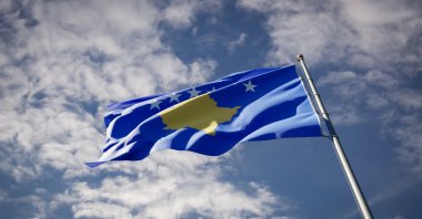 In this undated photo the national state flag of Kosovo flutters against the blue sky. (Shutterstock Photo)