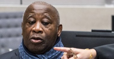 Former Ivory Coast president Laurent Gbagbo watches computer screens at the International Criminal Court in The Hague, Netherlands, Feb. 6, 2020. (AP Photo)