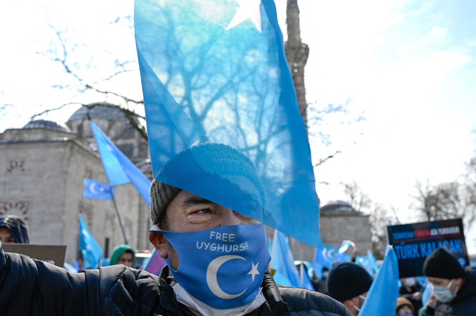 A protester from the Uyghur community living in Turkey attends a protest against the visit of China's Foreign Minister to Turkey, in Istanbul, March 25, 2021. (AFP Photo)