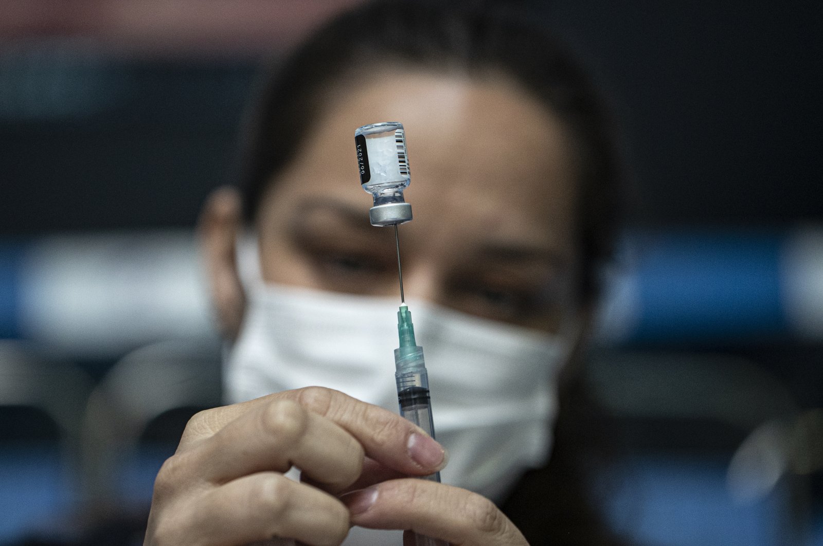 A health care worker prepares a dose of the Pfizer COVID-19 vaccine at the Victor Jara Stadium in Santiago, Chile, March 30, 2021. (AP Photo)