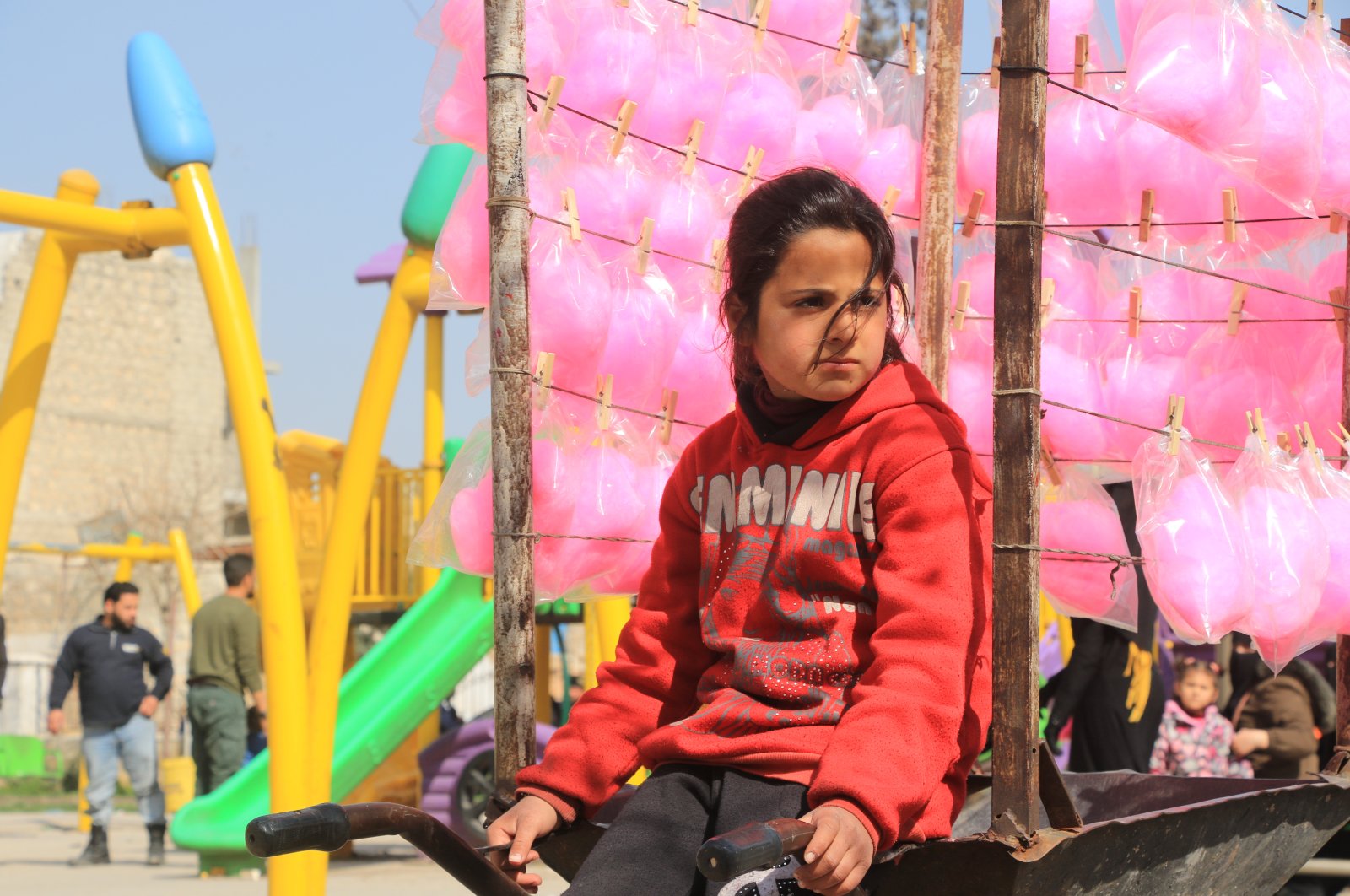 Kifah,10, sits in front of her cotton candy cart, al-Bab, Syria, March 31, 2021. (AA)