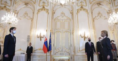 Slovak President Zuzana Caputova (R), appoints members of the new government to be headed by Prime Minister Eduard Heger (L), in Bratislava, Slovakia, April 1, 2021. (AP)