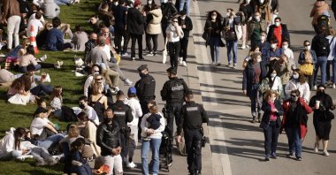 People take a walk along the Quay of the Seine river in Paris, France, March 28, 2021. (EPA-EFE Photo)