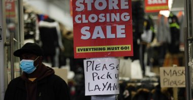 Sale signs are displayed in the window of a business in Brooklyn in New York City, U.S., Dec. 1, 2020. (AFP Photo)