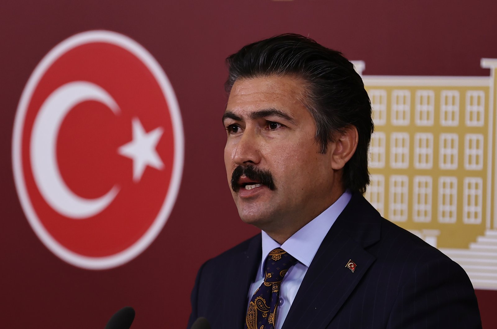 AK Party Group Deputy Chairperson Cahit Özkan speaks at a press conference in TBMM, Ankara, Turkey, April 1, 2021. (AA Photo)