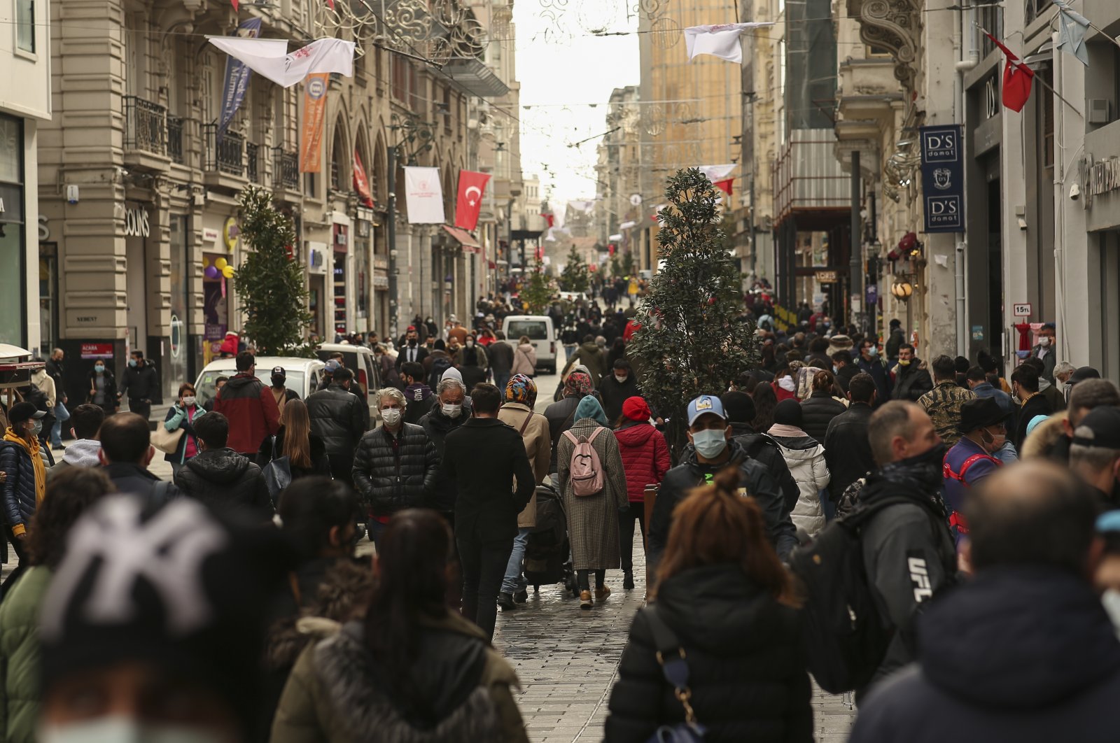 People walk on Istiklal street, the main shopping street of Istanbul, Turkey, March 25, 2021. (AP Photo)