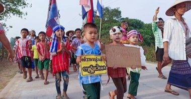 This handout from Kawkareik Open News taken and released to AFP on March 29, 2021, shows children taking part in a demonstration against the military coup in Kawkareik township in  Myanmar's Karen state. (Kawkareik Open News via AFP)