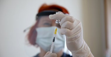 A nurse prepares a vaccine before administering a shot at a hospital, Kırklareli, northwestern Turkey, April 2, 2021. (AA PHOTO)