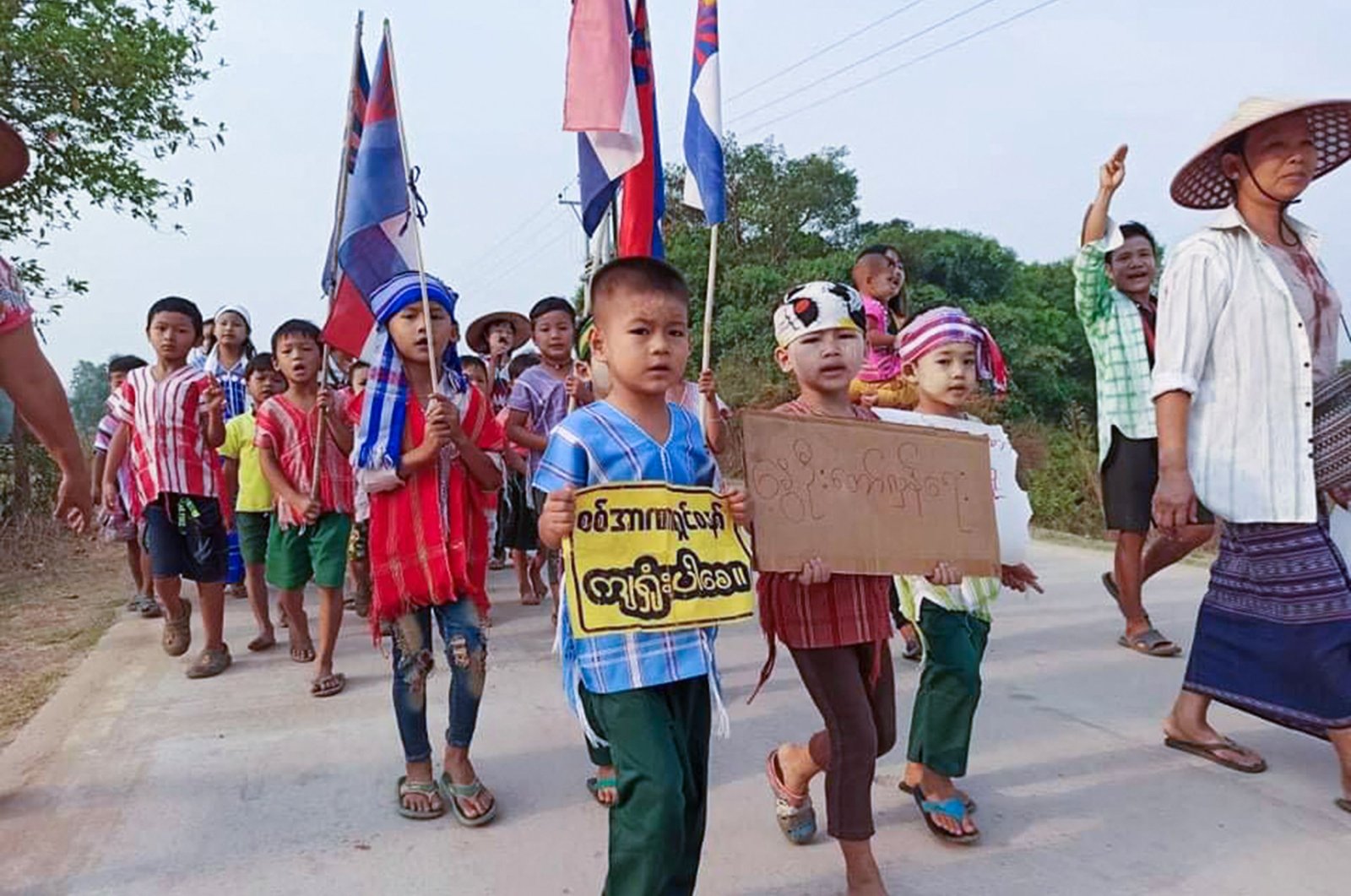 This handout from Kawkareik Open News taken and released to AFP on March 29, 2021, shows children taking part in a demonstration against the military coup in Kawkareik township in  Myanmar's Karen state. (Kawkareik Open News via AFP)