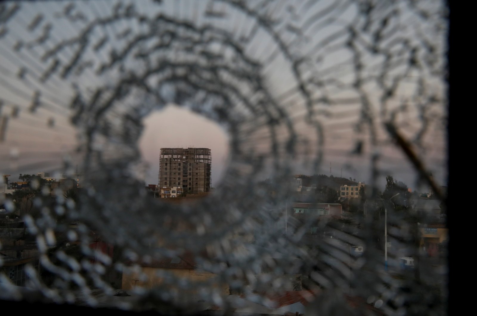 A building is seen through a bullet hole in a window of the Africa Hotel in the town of Shire, Tigray region, Ethiopia, March 17, 2021. (Reuters Photo)