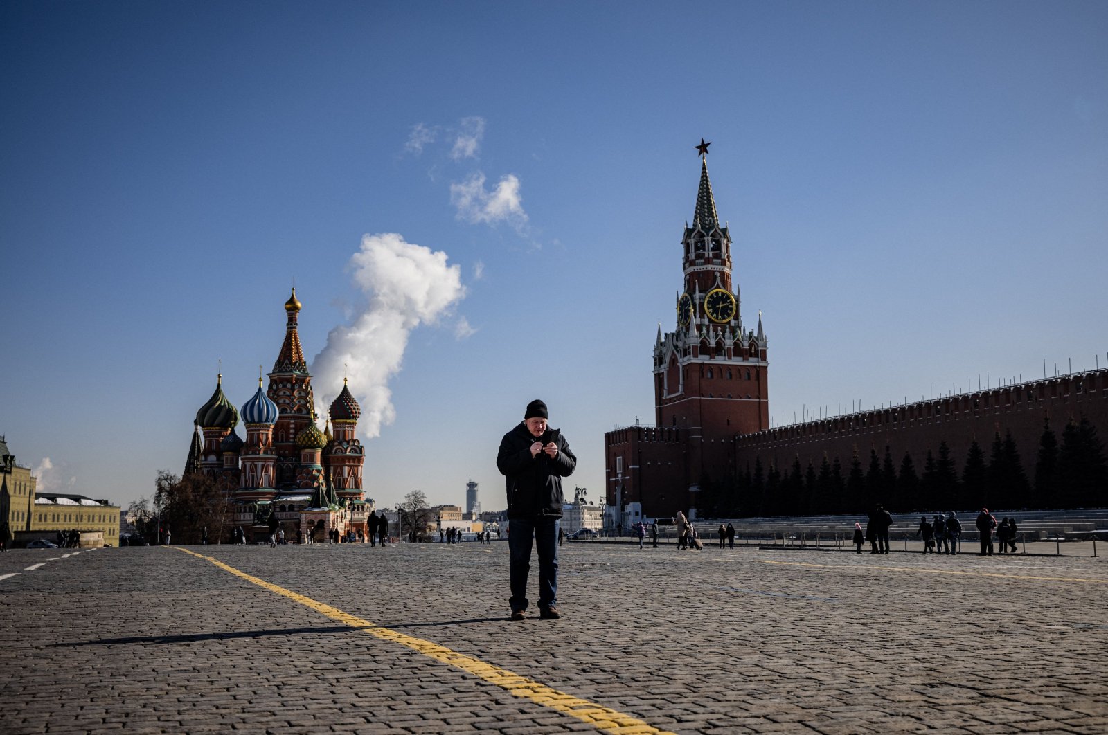 A man uses his mobile phone on Red Square in downtown Moscow, Russia, March 10, 2021. (AFP Photo)