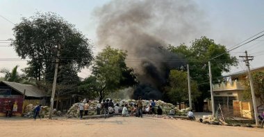 Protesters gather behind a barricade during a protest against the military coup, in Monywa, Myanmar, April 3, 2021. (Reuters Photo)