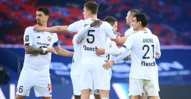 Lille's players celebrate after winning the French Ligue 1 football match between Paris-Saint Germain and Lille (LOSC) at the Parc des Princes Stadium in Paris, on April 3, 2021. (AFP Photo)