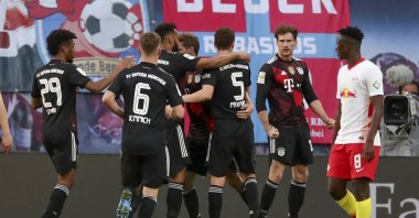 Bayern Munich's Leon Goretzka (2nd R) celebrates with teammates after scoring the opening goal during the German Bundesliga soccer match against RB Leipzig at Red Bull Arena, Leipzig, Germany, April 03, 2021. (Filip Singer/Pool/DFL via EPA)