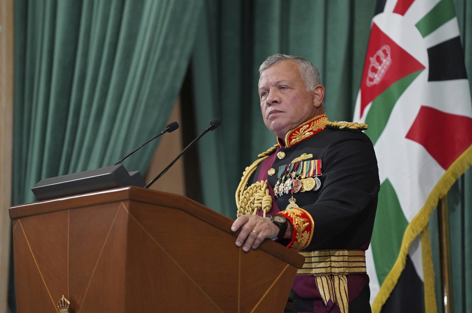 In this photo released by the Royal Hashemite Court, Jordan's King Abdullah II gives a speech during the inauguration of the 19th Parliament’s non-ordinary session, Amman, Jordan, Thursday, Dec. 10, 2020. (Yousef Allan/The Royal Hashemite Court via AP)