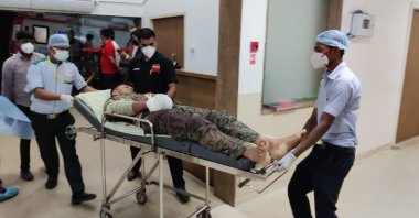 A paramilitary soldier injured in a gunbattle with Maoist rebels Saturday is brought for treatment at a hospital in Raipur, India, April 4, 2021. (AP Photo)