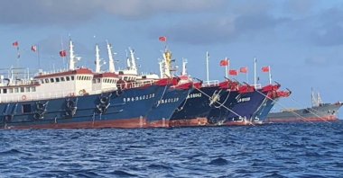In this photo provided by the National Task Force-West Philippine Sea, Chinese vessels are moored at Whitsun Reef, South China Sea, March 27, 2021. (AP Photo)