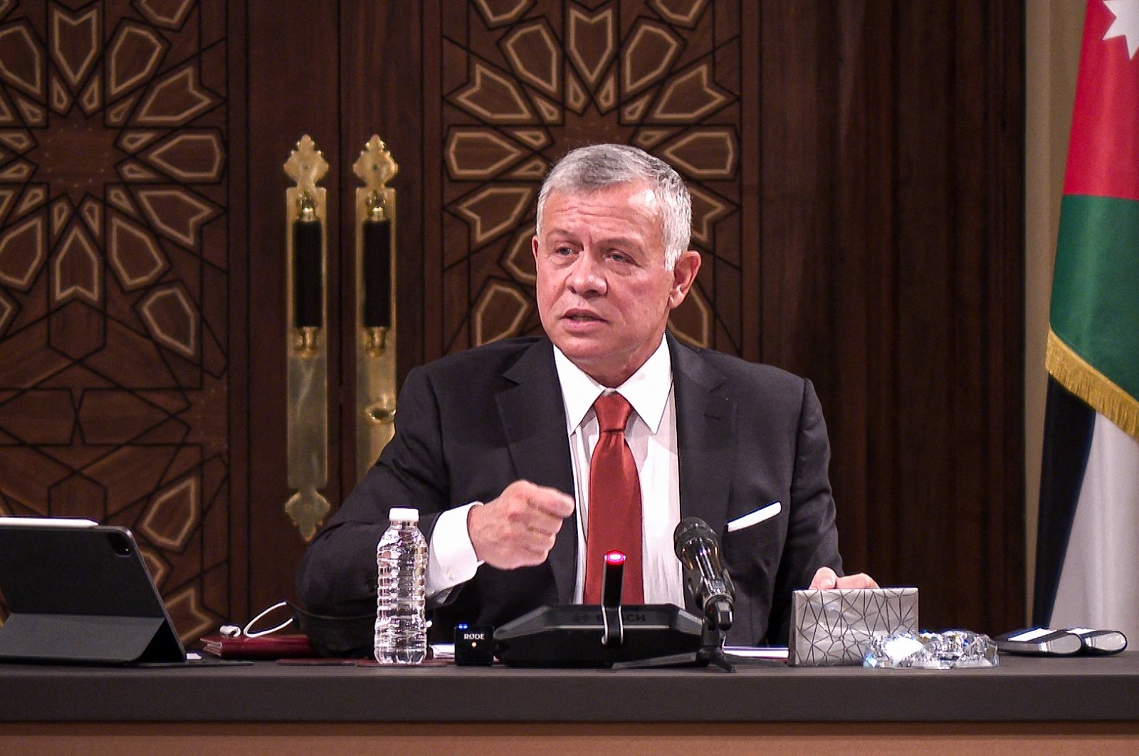 Jordanian King Abdullah II speaks during a meeting in the capital Amman, Jordan, March 23, 2021. (Jordanian Royal Palace / AFP)