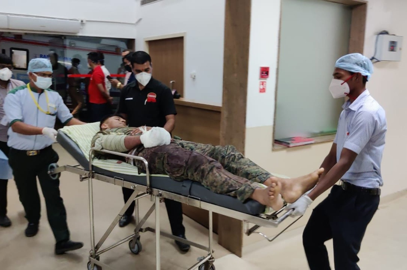 A paramilitary soldier injured in a gunbattle with Maoist rebels Saturday is brought for treatment at a hospital in Raipur, India, April 4, 2021. (AP Photo)