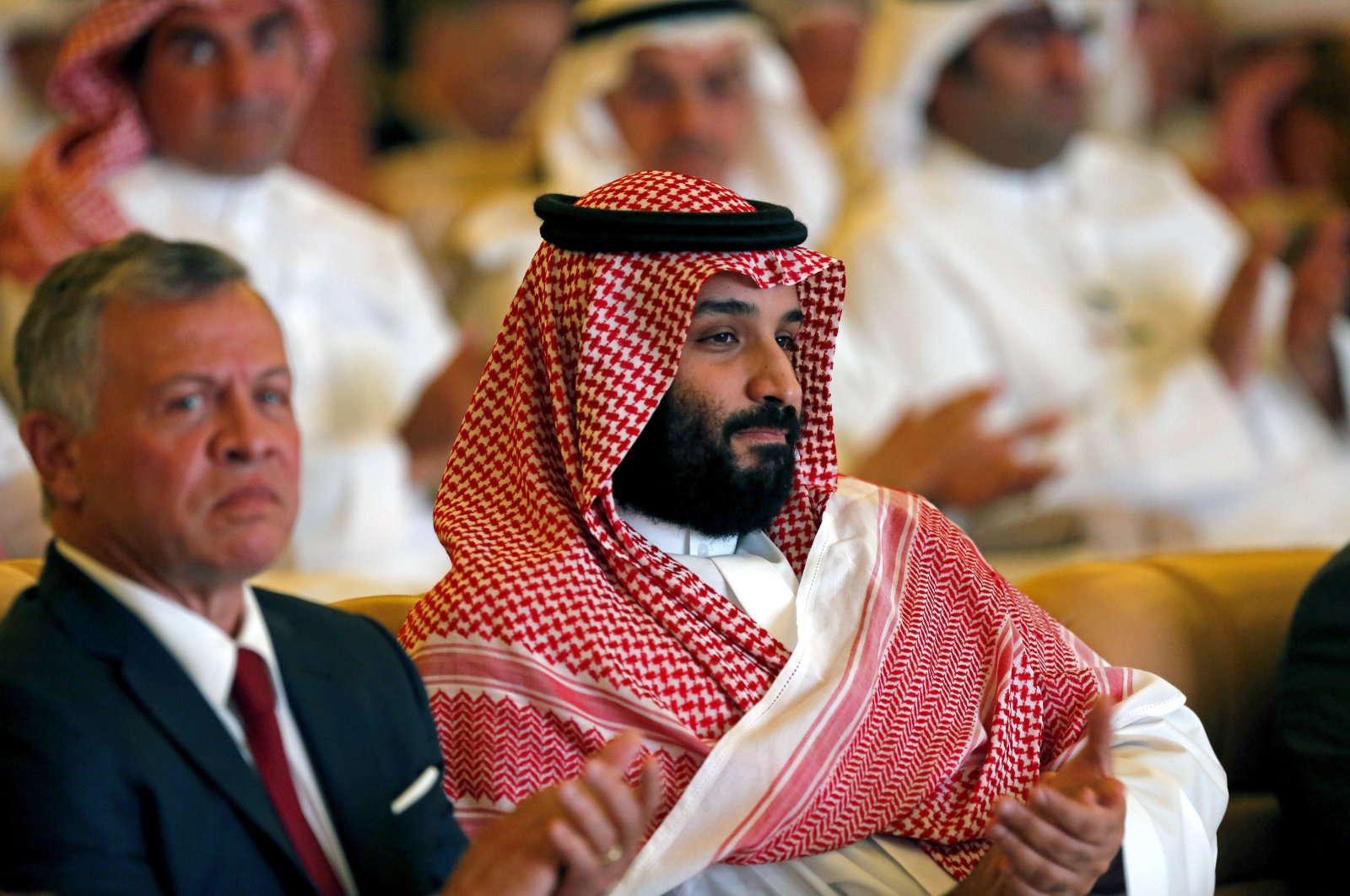 Saudi Crown Prince, Mohammed bin Salman (R) and Jordan's King Abdullah II, applaud at the Future Investment Initiative conference, in Riyadh, Saudi Arabia, Oct. 23, 2018. (AP File Photo)