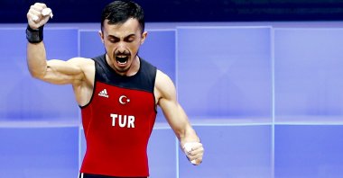 Turkey's Muammer Şahin celebrates after his turn in the men's 55-kilogram weight class final at the Weightlifting European Championships 2021 in Moscow, Russia, April 4, 2021. (AA Photo)