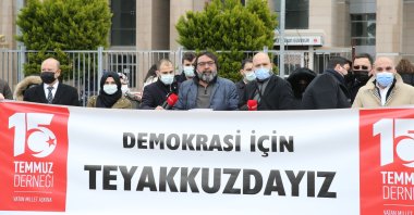People protest the retired admirals’ declaration as they hold a banner that reads "We are on the alert for democracy," in Istanbul, Turkey, April 5, 2021. (AA Photo)