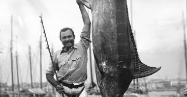 In this July 1934 photo provided by the John F. Kennedy Library Foundation, Ernest Hemingway poses with a marlin at Havana Harbor, in Key West, Florida, U.S. (AP Photo)