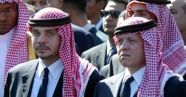 Former Jordanian Crown Prince Hamzah bin Al Hussein (L) with his half-brother King Abdullah II of Jordan (R) as they walk together in the funeral procession of Palestinian President Yasser Arafat in Cairo, Egypt, 12 Nov. 12, 2004.  (EPA-EFE/MIKE NELSON)