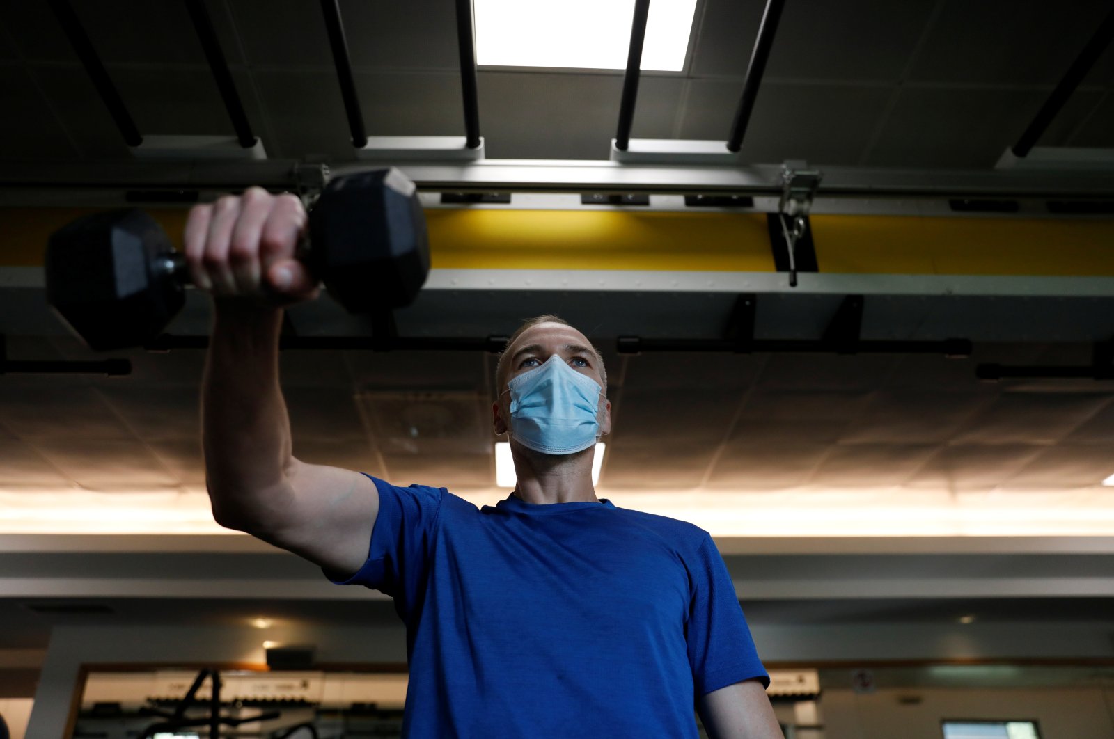 A man trains in a gym on the first day of the reopening of gyms after a countrywide lockdown, amid the coronavirus disease (COVID-19) pandemic, Lisbon, Portugal, April 5, 2021. (REUTERS Photo)