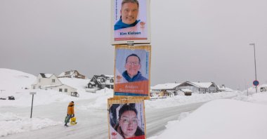 Election campaign posters with candidates for the legislative elections of the Siumut party, including Greenland's Prime Minister Kim Kielsen (top), are plastered on a lamppost in Nuuk, Greenland, April 5, 2021. (AFP Photo)
