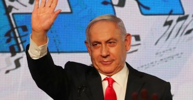 Israeli Prime Minister Benjamin Netanyahu gestures as he delivers a speech to supporters following the announcement of exit polls in Israel's general election at his Likud party headquarters, Jerusalem, Israel, March 24, 2021. (Reuters Photo)