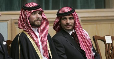 Former Crown Prince Hamzah (R) and Prince Hashem, half brothers of King Abdullah II of Jordan, attend the opening of the parliament in Amman, Jordan, Nov. 28, 2006. (AP Photo)