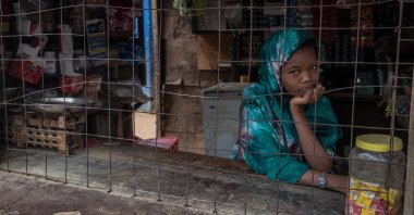 A girl looks out from inside a shop in the Dadaab refugee camp, Dadaab, Kenya, Oct. 8, 2018. (Photo by Getty Images)