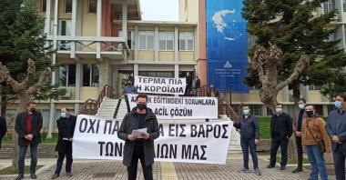 Parents and their supporters take part in a demonstration protesting the Greek government's postponement of community board member elections at minority schools in Komotini (Gümülcine), northern Greece, April 6, 2021. (AA Photo)