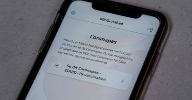 A smartphone with the MinSundhed app and a Corona passport link, Copenhagen, Denmark, March 23, 2021. (AFP Photo)