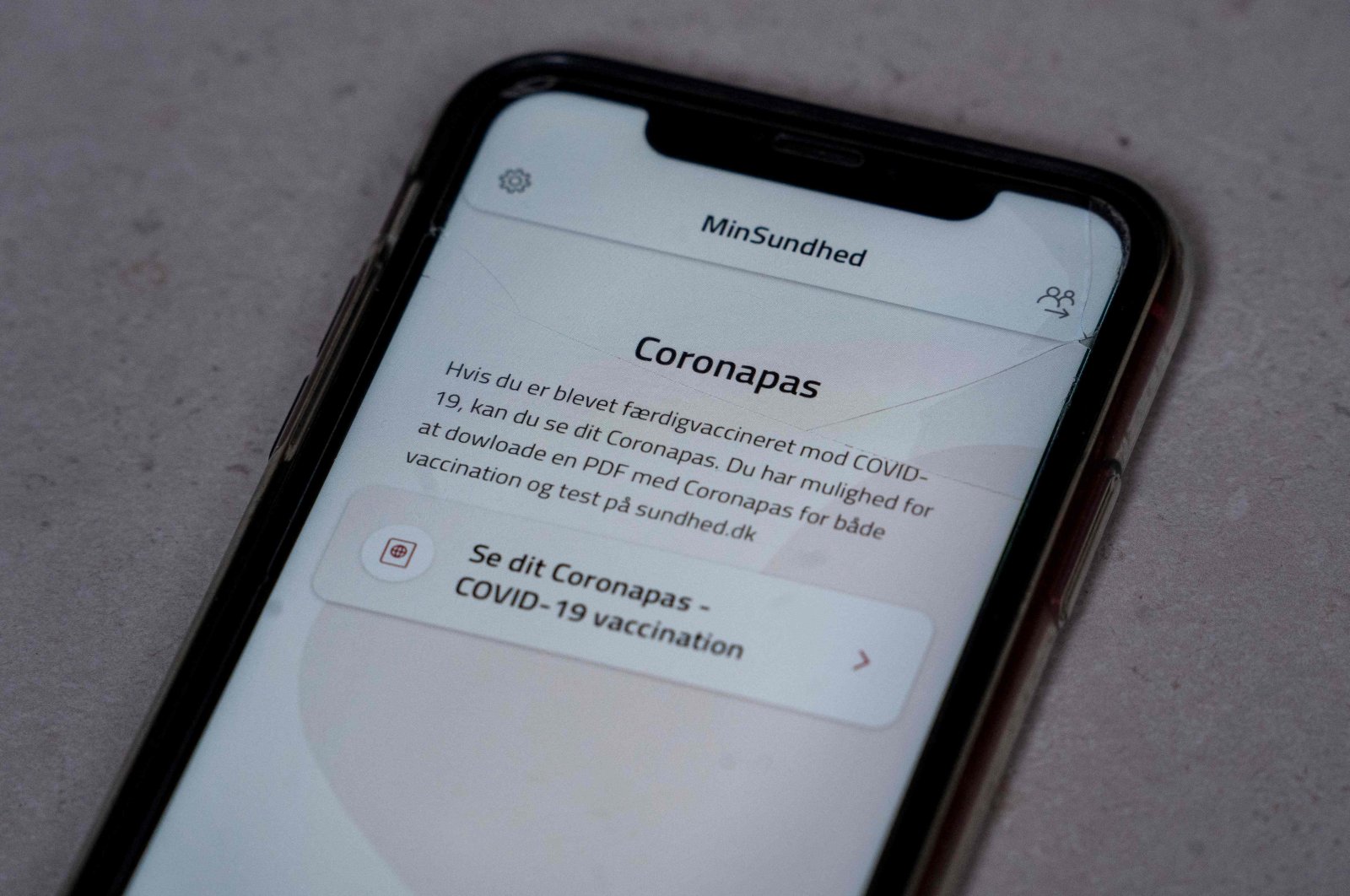 A smartphone with the MinSundhed app and a Corona passport link, Copenhagen, Denmark, March 23, 2021. (AFP Photo)