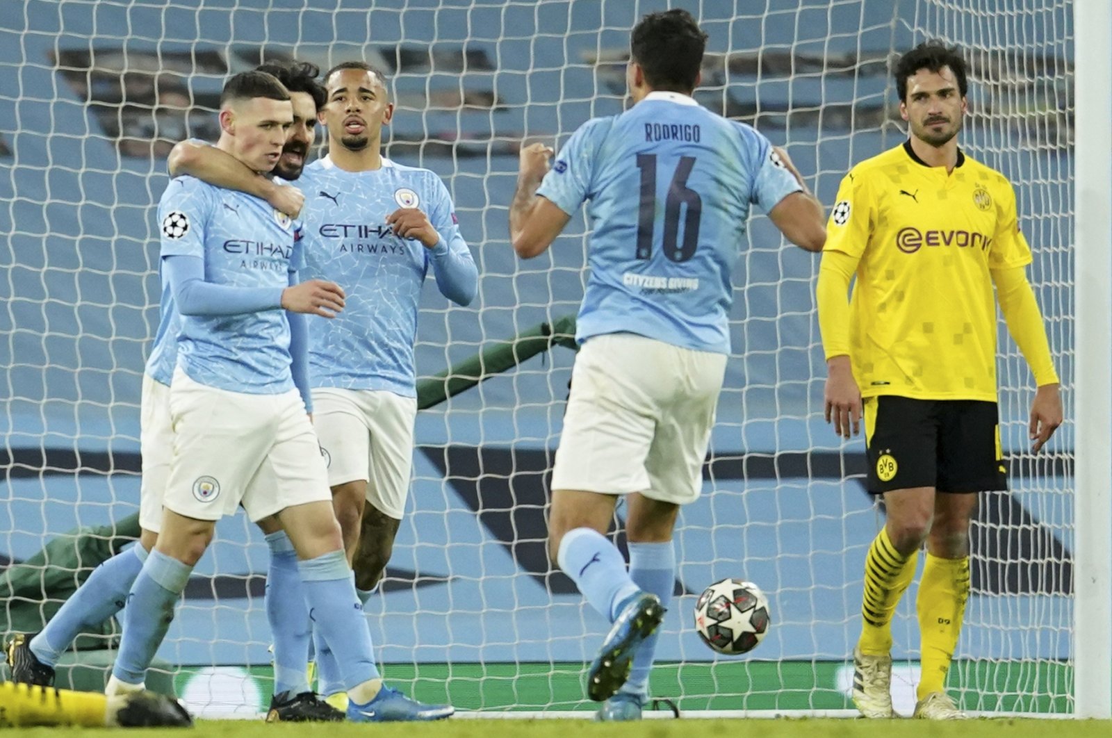 Manchester City's Phil Foden (L) celebrates after scoring his side's second goal during the Champions League, first leg, quarterfinal football match between Manchester City and Borussia Dortmund at the Etihad stadium in Manchester, Tuesday, April 6, 2021. (AP Photo)