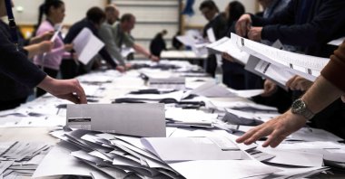Electoral workers count ballots in a parliament election in Nuuk, Denmark, April 6, 2021. (AP Photo)