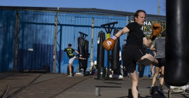 Kickboxers keep their distance while training outdoors in Amsterdam, Netherlands, March 30, 2021. (AP Photo)