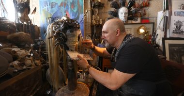 Uğur Çalışkan making one of his post-apocalyptic sculptures in this photo provided on April 6, 2021. (AA Photo)
