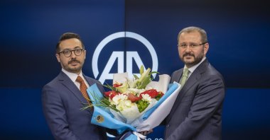 Serdar Karagöz (L) poses with his predecessor Şenol Kazancı at a handover ceremony, in the capital Ankara, Turkey, April 7, 2021. (AA PHOTO)