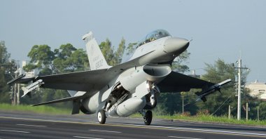 A Taiwan Air Force F-16 fighter jet lands on a closed section of highway during the annual Han Kuang military exercises in Chiayi, central Taiwan, Sept. 16, 2014. (AP Photo)