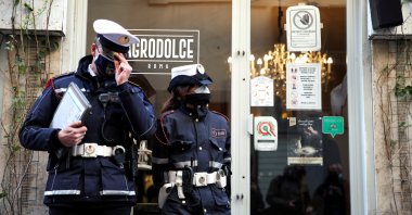 Municipal police stand outside a restaurant near the Trevi Fountain in Rome, Italy, April 7, 2021. (Reuters Photo)