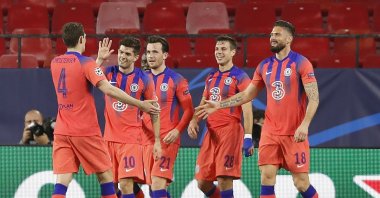 Chelsea players celebrate after Chelsea's Ben Chilwell scored his side's second goal during the Champions League, first leg, quarterfinal soccer match between FC Porto and Chelsea at the Ramon Sanchez-Pizjuan stadium in Seville, Spain, Wednesday, Apr. 7, 2021. (AP Photo)