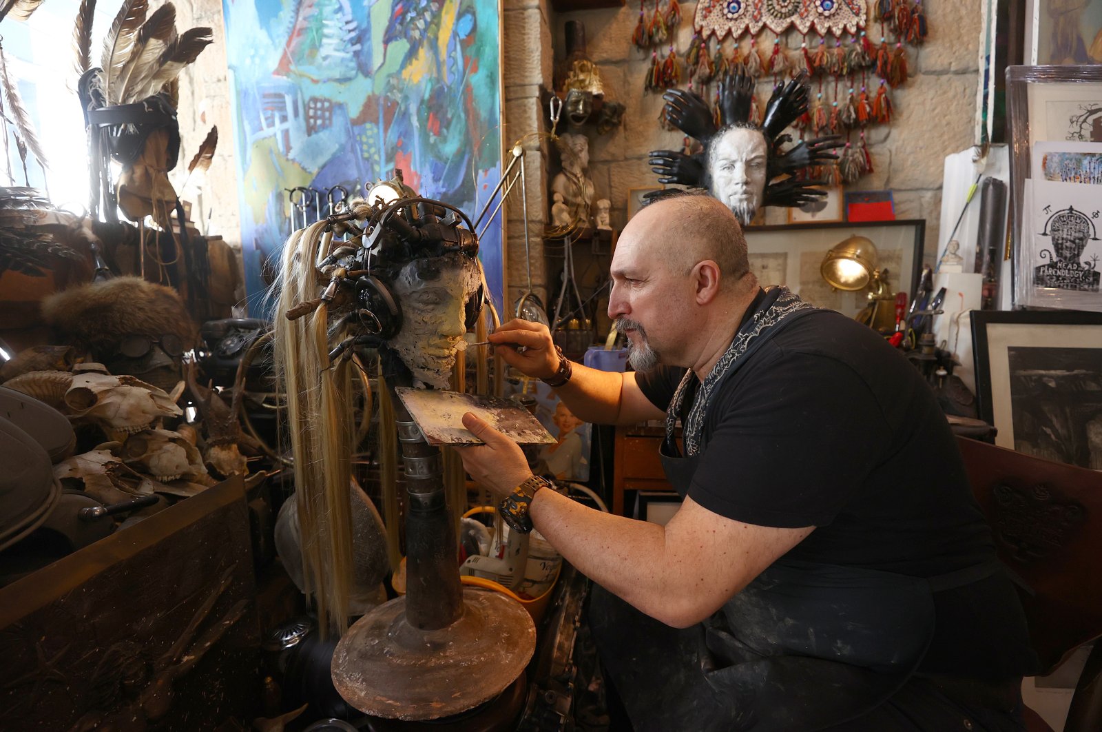 Uğur Çalışkan making one of his post-apocalyptic sculptures in this photo provided on April 6, 2021. (AA Photo)