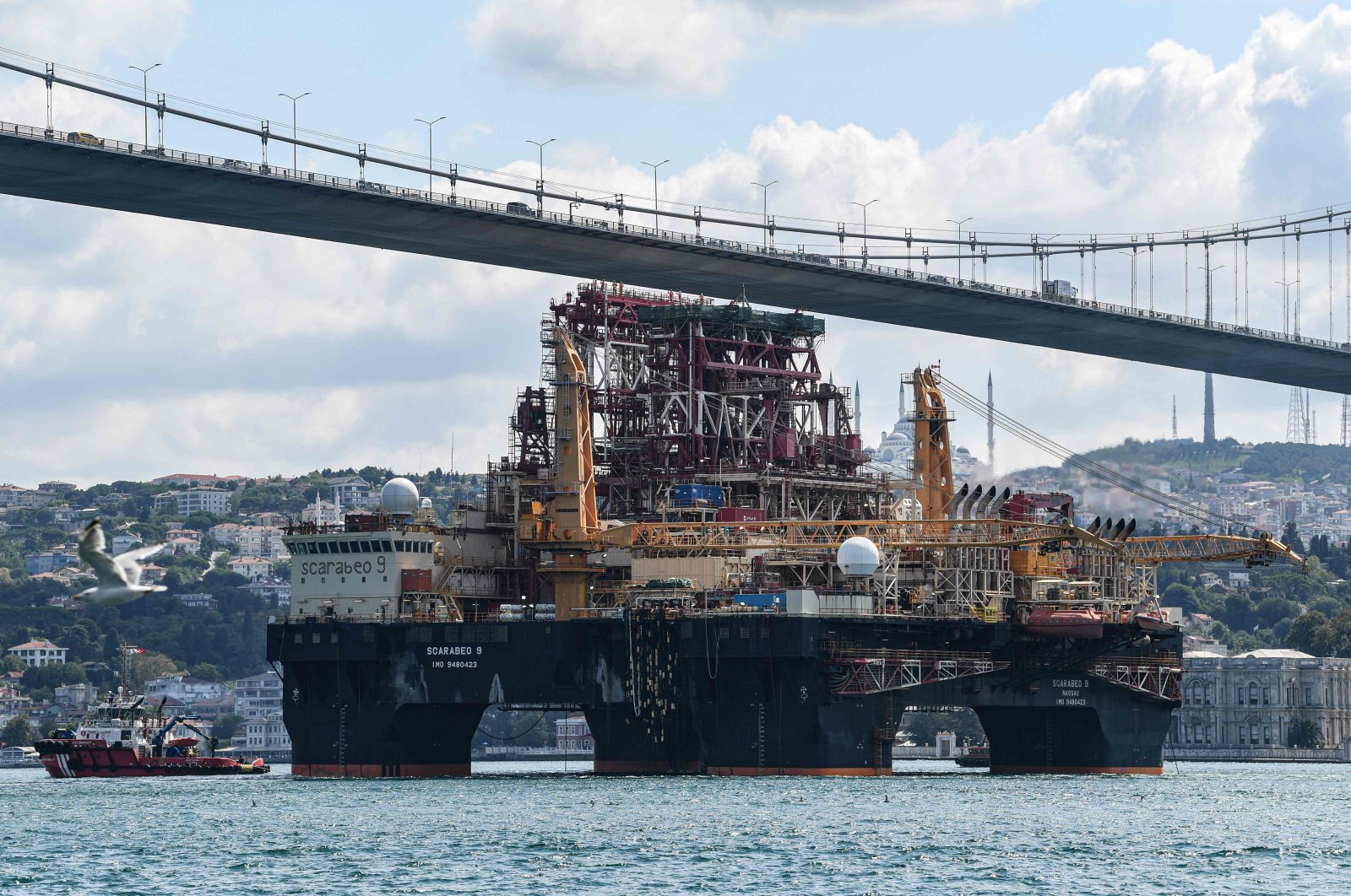 Scarabeo 9, a 115-meter-long and 78-meter-high Frigstad D90-type semi-submersible drilling rig, passes under the July 15th Martyrs Bridge on the Bosphorus Strait en route to the Black Sea, Istanbul, Turkey, Aug. 29, 2019. (AFP Photo)